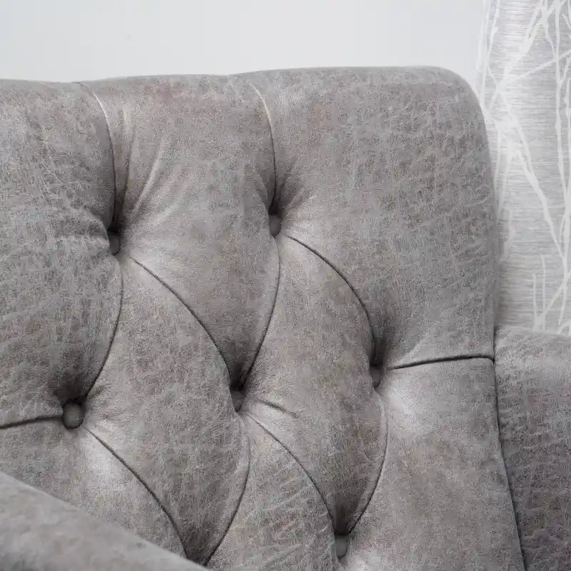 Fauteuil club capitonné en tissu gris ardoise
